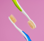two mouthwatchers toothbrushes side to side 