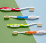 Four Mouthwatchers toothbrushes in assorted colors 