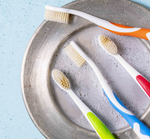 Four mouthwatchers toothbrushes in assorted colors 