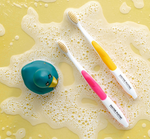 two mouthwaatchers toothbrushes side to side 