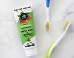Dr plotka's whitening toothpaste and two Mouthwatchers toothbrushes